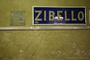 Vintage Zibello sign on an aged wall, capturing rustic Italian charm and history.