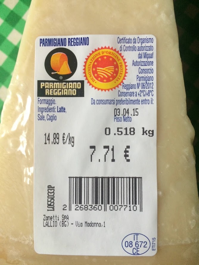 Parmigiano Reggiano cheese wheel aging in Emilia Romagna