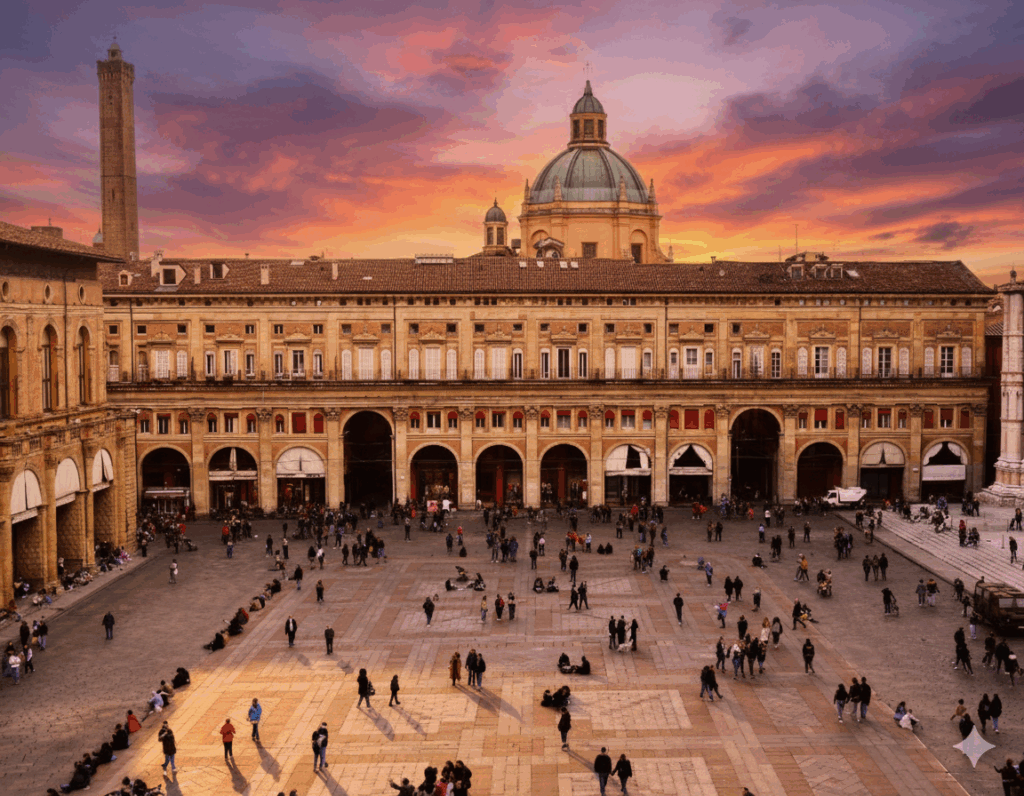 Palazzo d’Accursio in Piazza Maggiore, Bologna, historic red-brick city hall with medieval and Renaissance architectural features.