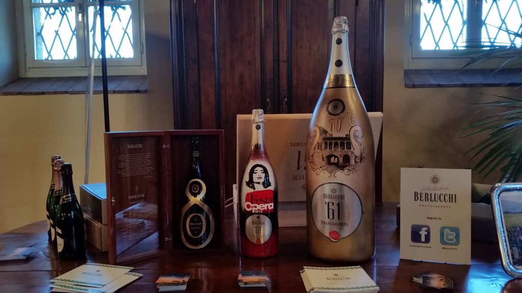 Berlucchi Franciacorta Opera wine bottles on display at a northern Italian winery
