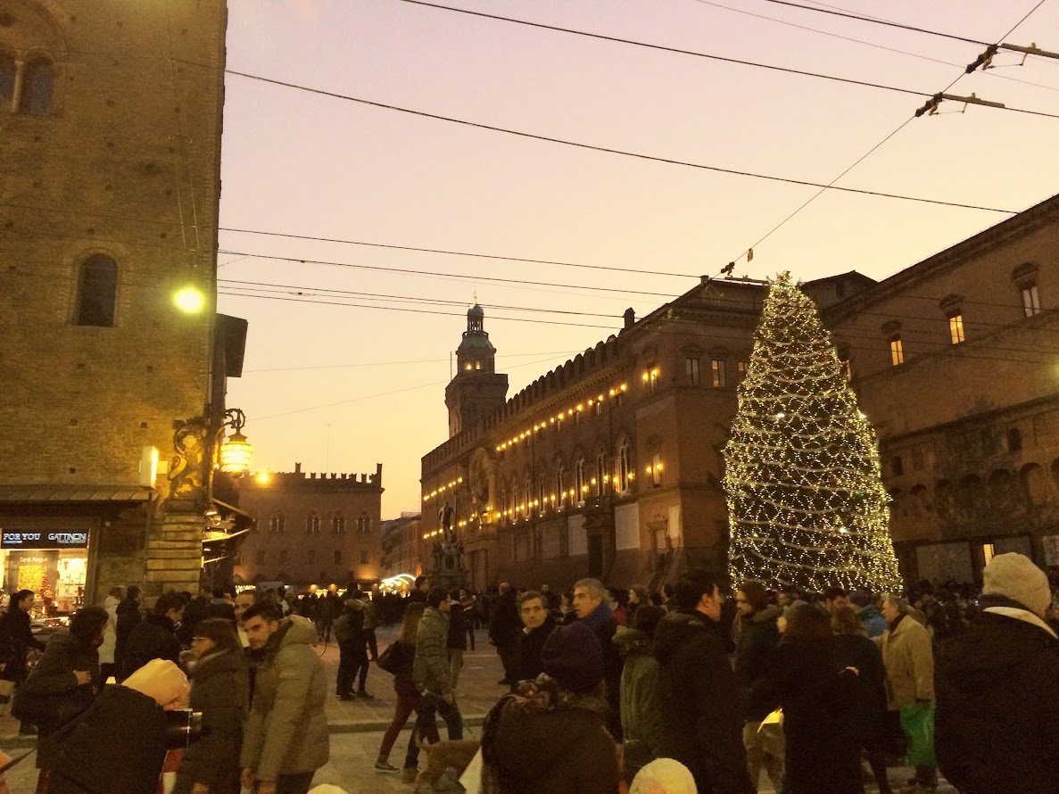 People walking through the porticoes of central Bologna on a free walking tour