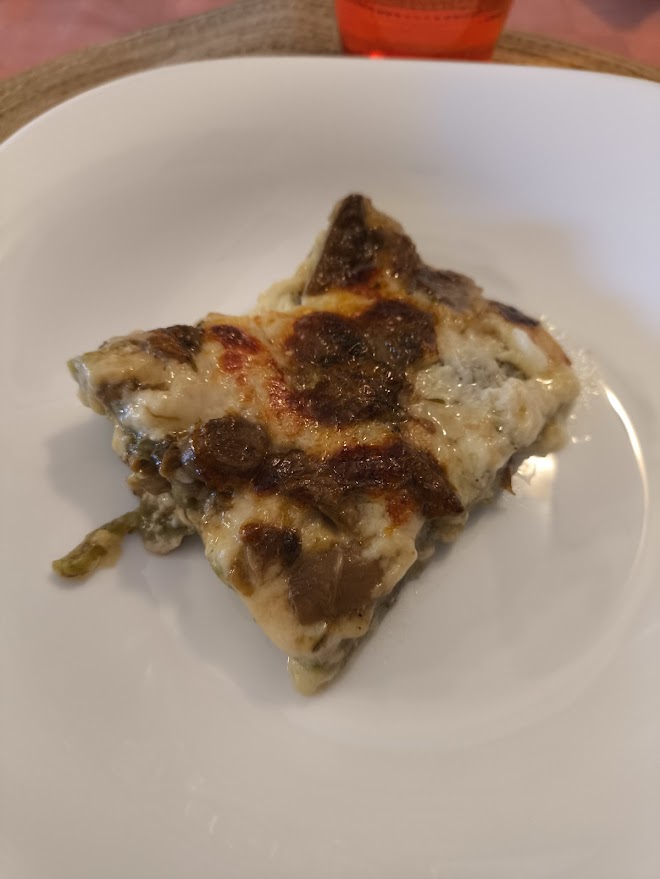 Lasagne verdi alla bolognese — green spinach pasta layered with ragù and béchamel