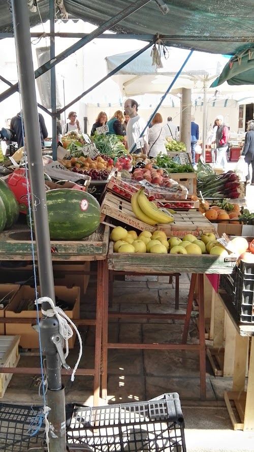 Fresh vegetables and local produce on display at an Italian market