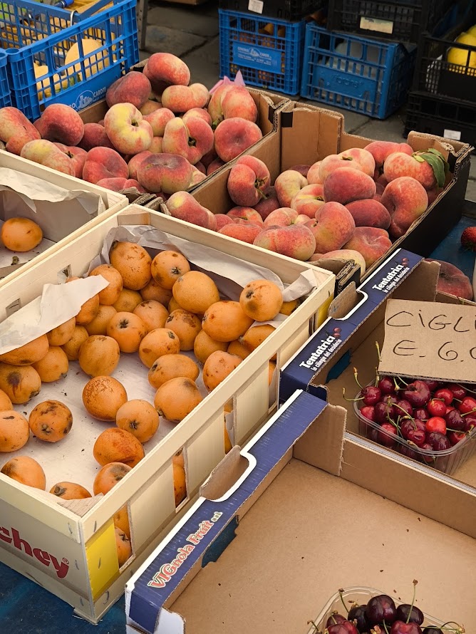 Local vendors selling fresh produce and regional specialities at an Italian street market